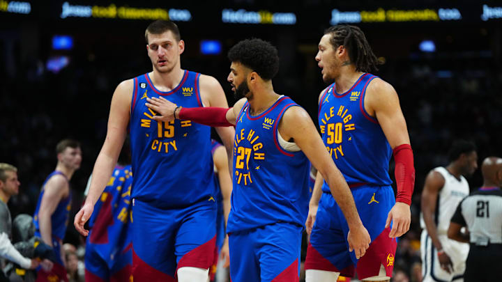 Mar 3, 2023; Denver, Colorado, USA; Denver Nuggets center Nikola Jokic (15) and guard Jamal Murray (27) and forward Aaron Gordon (50) celebrate after defeating the Memphis Grizzlies at Ball Arena. Mandatory Credit: Ron Chenoy-Imagn Images