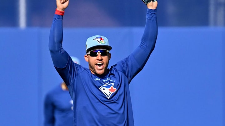  Blue Jays outfielder George Springer celebrates after catching a fly ball during spring training at Bobby Mattick Training Center at Englebert Complex.