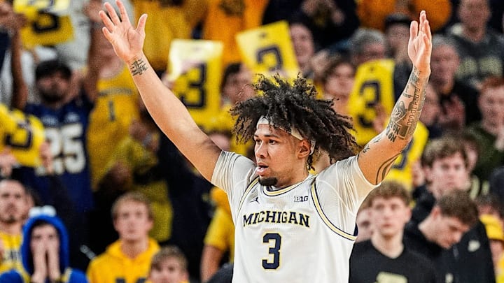 Michigan guard Tre Donaldson (3) celebrates a three point basket against Purdue during the second half at Crisler Center in Ann Arbor on Tuesday, Feb. 11, 2025. Michigan guard Tre Donaldson (3) celebrates a three point basket against Purdue during the second half at Crisler Center in Ann Arbor on Tuesday, Feb. 11, 2025.