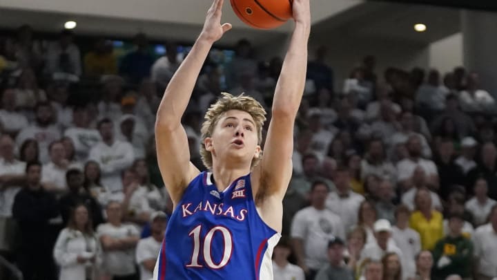 Mar 2, 2024; Waco, Texas, USA; Kansas Jayhawks guard Johnny Furphy (10) drives to the basket as Baylor Bears guard Jayden Nunn (2) defends during the first half at Paul and Alejandra Foster Pavilion. Mandatory Credit: Raymond Carlin III-USA TODAY Sports