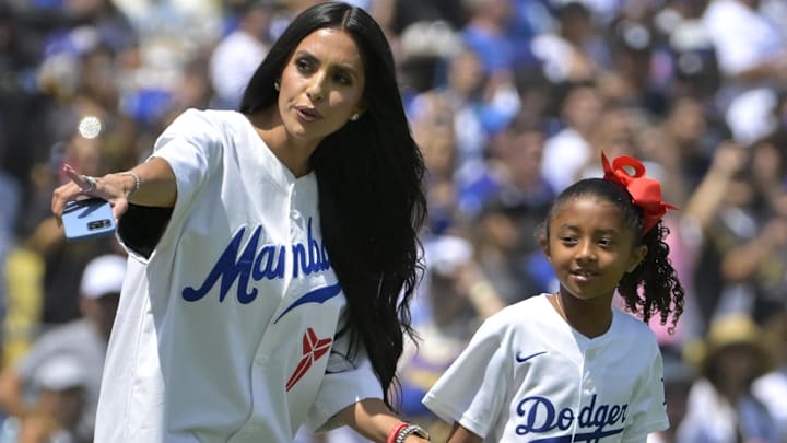 Vanessa Bryant, widow of Los Angeles Lakers Kobe Bryant, accompanies their daughter Bianka, 7, to the mound to throw out the first pitch against the Tampa Bay Rays.