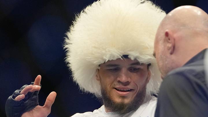Mar 5, 2022; Las Vegas, Nevada, UNITED STATES; Umar Nurmagomedov (blue gloves) celebrates after defeating Brian Kelleher (not pictured) during UFC 272 at T-Mobile Arena. Mandatory Credit: Stephen R. Sylvanie-USA TODAY Sports