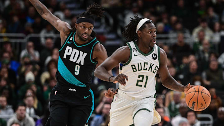 Nov 21, 2022; Milwaukee, Wisconsin, USA: Milwaukee Bucks guard Jrue Holiday (21) drives for the basket against Portland Trail Blazers forward Jerami Grant (9) in the second quarter at Fiserv Forum. Mandatory Credit: Benny Sieu-Imagn Images