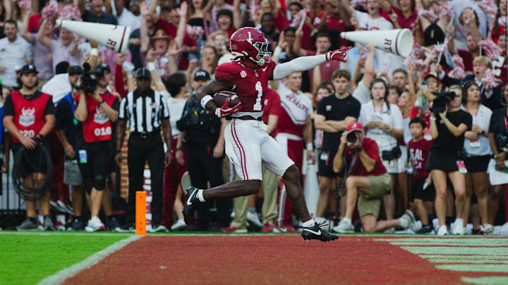 Aug 31, 2024; Tuscaloosa, Alabama, USA; Alabama Crimson Tide wide receiver Kendrick Law (1) scores a touchdown against the Western Kentucky Hilltoppers during the first quarter at Bryant-Denny Stadium. Mandatory Credit: Will McLelland-Imagn Images