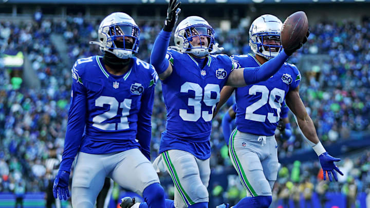 Nov 30, 2025; Seattle, Washington, USA; Seattle Seahawks safety Ty Okada (39) celebrates after retrieving a fumble during the second half against the Minnesota Vikings at Lumen Field. Mandatory Credit: Kevin Ng-Imagn Images