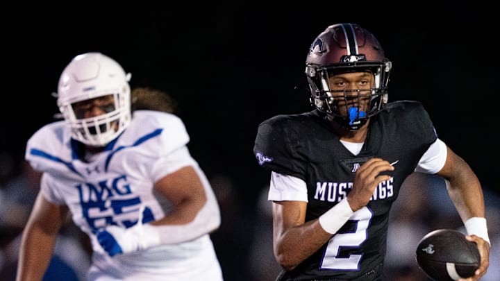 Lipscomb's Deuce Knight (2) runs away from IMG's Jayden Jackson (65) at Lipscomb's Reese Smith Football Field in Nashville, Tenn., Friday night, Aug. 18, 2023.