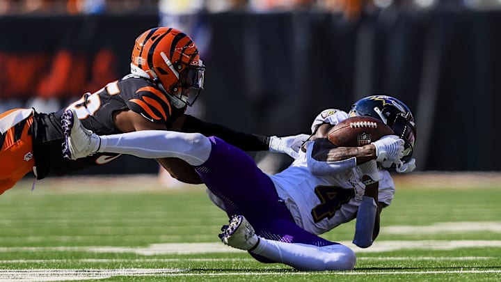 Oct 6, 2024; Cincinnati, Ohio, USA; Baltimore Ravens wide receiver Zay Flowers (4) catches a pass against Cincinnati Bengals cornerback Jalen Davis (35) in the second half at Paycor Stadium. Mandatory Credit: Katie Stratman-Imagn Images