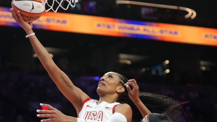 Team USA center A'ja Wilson (9) lays the ball up over Team WNBA forward Angel Reese (5) during the WNBA All-Star Game at Footprint Center in Phoenix on July 20, 2024. Team USA center A'ja Wilson (9) lays the ball up over Team WNBA forward Angel Reese (5) during the WNBA All-Star Game at Footprint Center in Phoenix on July 20, 2024.