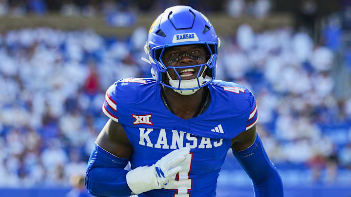 Aug 23, 2025; Lawrence, Kansas, USA; Kansas Jayhawks linebacker Trey Lathan (4) warms up prior to a game against the Fresno State Bulldogs at David Booth Kansas Memorial Stadium. Mandatory Credit: Jay Biggerstaff-Imagn Images Aug 23, 2025; Lawrence, Kansas, USA; Kansas Jayhawks linebacker Trey Lathan (4) warms up prior to a game against the Fresno State Bulldogs at David Booth Kansas Memorial Stadium. Mandatory Credit: Jay Biggerstaff-Imagn Images