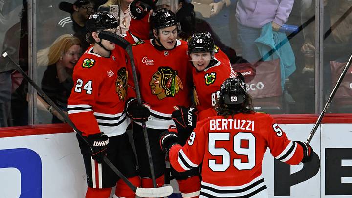 Oct 10, 2026; Chicago, Illinois, USA;  Chicago Blackhawks right wing Roman Kantserov (80), right,  celebrates with  teammmates  after scoring a goal against the  Carolina Hurricanes  during the second period at the United Center.  Mandatory Credit: Matt Marton-Imagn Images