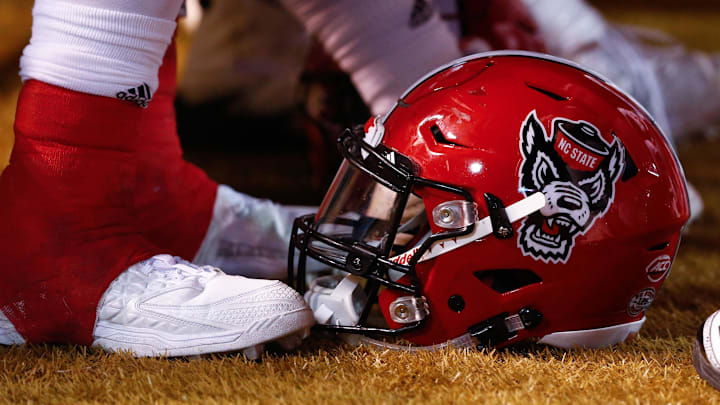Nov 18, 2017; Winston-Salem, NC, USA; A North Carolina State Wolfpack helmet lays on the sidelines during the game against the Wake Forest Demon Deacons at BB&T Field. Mandatory Credit: Jeremy Brevard-Imagn Images Nov 18, 2017; Winston-Salem, NC, USA; A North Carolina State Wolfpack helmet lays on the sidelines during the game against the Wake Forest Demon Deacons at BB&T Field. Mandatory Credit: Jeremy Brevard-Imagn Images