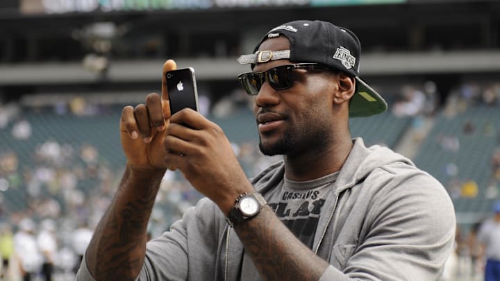 Sep 25, 2011; Philadelphia, PA, USA; Professional basketball player LeBron James takes pictures with his camera phone along the Philadelphia Eagles sideline prior to the game against the New York Giants at Lincoln Financial Field. Mandatory Credit: Howard Smith-Imagn Images