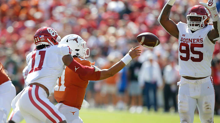 Oklahoma's Nik Bonitto (11) and Isaiah Thomas (95) put pressure on Texas' Casey Thompson (11) during the Red River Showdown college football game between the University of Oklahoma Sooners (OU) and the University of Texas (UT) Longhorns at the Cotton Bowl in Dallas, Saturday, Oct. 9, 2021. Oklahoma won 55-48.
Ou Vs Texas Oklahoma's Nik Bonitto (11) and Isaiah Thomas (95) put pressure on Texas' Casey Thompson (11) during the Red River Showdown college football game between the University of Oklahoma Sooners (OU) and the University of Texas (UT) Longhorns at the Cotton Bowl in Dallas, Saturday, Oct. 9, 2021. Oklahoma won 55-48.
Ou Vs Texas