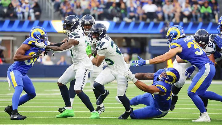 Seattle Seahawks Running Back Kenny McIntosh (25) attempts to break from the tackle at SoFi Stadium for the Seattle Seahawks. Seattle Seahawks Running Back Kenny McIntosh (25) attempts to break from the tackle at SoFi Stadium for the Seattle Seahawks.