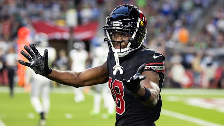Dec 8, 2024; Glendale, Arizona, USA; Arizona Cardinals wide receiver Marvin Harrison Jr. (18) against the Seattle Seahawks at State Farm Stadium. Mandatory Credit: Mark J. Rebilas-Imagn Images