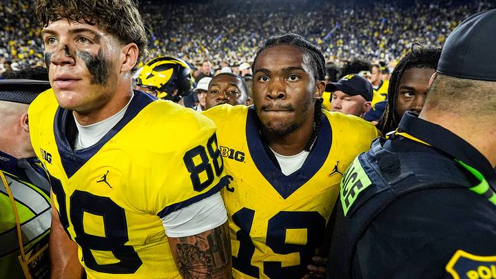 Michigan quarterback Bryce Underwood (19), center, and tight end Deakon Tonielli (88) exit the field after 13-12 win over Western Michigan at Michigan Stadium in Ann Arbor on Saturday, Sept. 5, 2026.