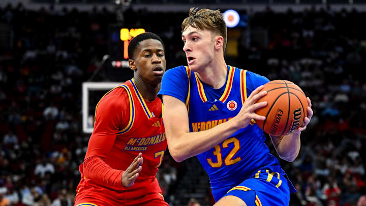 Apr 2, 2024; Houston, TX, USA; McDonald's All American East forward Cooper Flagg (32) controls the ball as McDonald's All American West guard Valdez Edgecombe Jr (7) defends during the first half at Toyota Center. Mandatory Credit: Maria Lysaker-Imagn Images