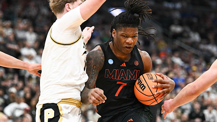 Mar 22, 2026; St. Louis, MO, USA; Miami Hurricanes forward Shelton Henderson (7) drives to the basket as Purdue Boilermakers guard Jack Benter (14) defends during the second half during a second round game of the men's 2026 NCAA Tournament at Enterprise Center. Mandatory Credit: Jeff Le-Imagn Images Mar 22, 2026; St. Louis, MO, USA; Miami Hurricanes forward Shelton Henderson (7) drives to the basket as Purdue Boilermakers guard Jack Benter (14) defends during the second half during a second round game of the men's 2026 NCAA Tournament at Enterprise Center. Mandatory Credit: Jeff Le-Imagn Images