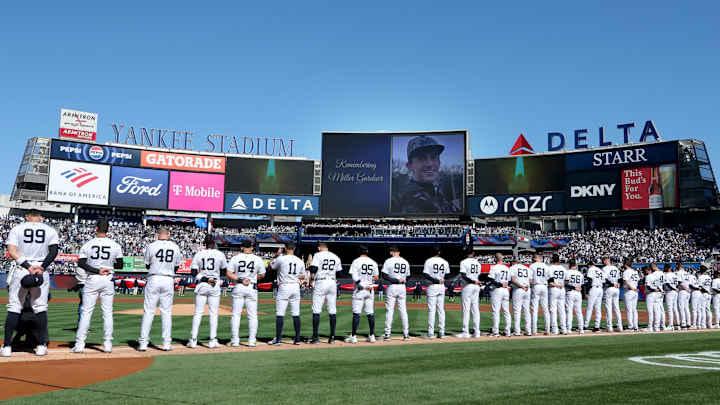 Mar 27, 2025; Bronx, New York, USA; New York Yankees players stand for a moment of silence to honor the memory of Miller Gardner son of Yankees former player Brett Gardner.