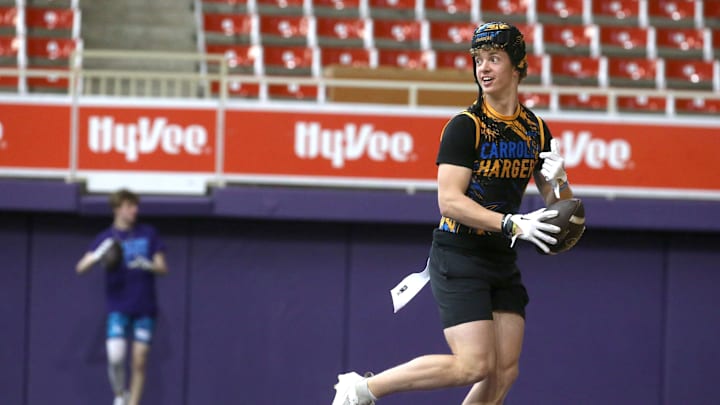 The Carroll Chargers’ Jaxx DeJean warms up before a 7-on-7 football tournament game Saturday, April 13, 2024 at the UNI Dome in Cedar Falls, Iowa.