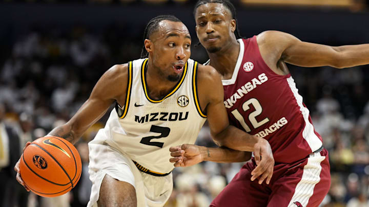 sJan 31, 2024; Columbia, Missouri, USA; Missouri Tigers guard Tamar Bates (2) drives against Arkansas.