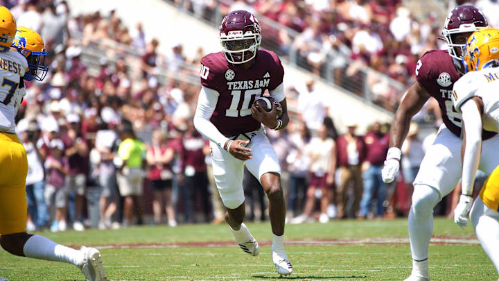 Sep 7, 2024; College Station, Texas, USA; Texas A&M Aggies quarterback Marcel Reed (10) runs the ball against the McNeese State Cowboys during the second quarter at Kyle Field.