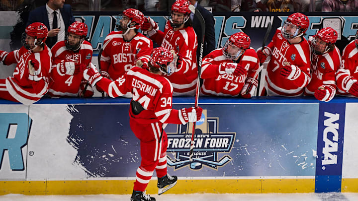 Apr 12, 2025; St. Louis, Missouri, UNITED STATES; Boston University Terriers forward Cole Eiserman (34) celebrates with teammates after scoring a goal against the Western Michigan Broncos during the first period of the Frozen Four college ice hockey national championship at Enterprise Center. Mandatory Credit: Connor Hamilton-Imagn Images