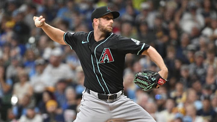 Sep 21, 2024; Milwaukee, Wisconsin, USA; Arizona Diamondbacks pitcher Merrill Kelly (29) delivers a pitch against the Milwaukee Brewers in the first inning at American Family Field. Mandatory Credit: Michael McLoone-Imagn Images