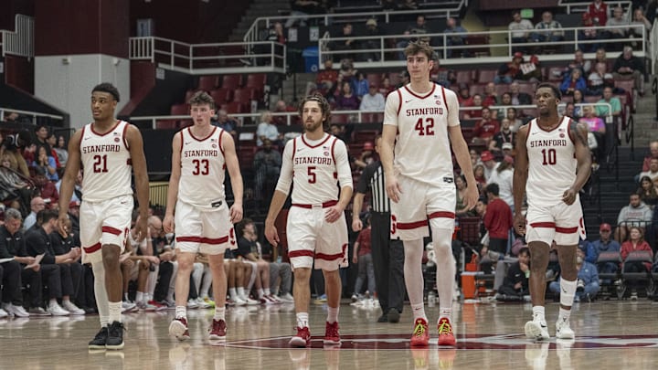 Feb 26, 2025; Stanford, California, USA;  Stanford Cardinal guard Jaylen Blakes (21), forward Evan Stinson (33) , guard Benny Gealer (5), forward Maxime Raynaud (42) and forward Chisom Okpara (10) walk back onto the court during the second half against the Boston College Eagles at Maples Pavilion. Mandatory Credit: Stan Szeto-Imagn Images