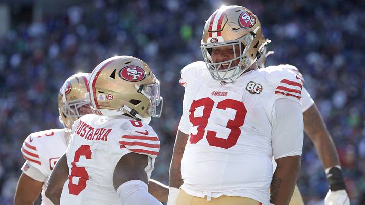 Oct 11, 2026; Seattle, Washington, USA; San Francisco 49ers defensive tackle Gracen Halton (93) celebrates with safety Malik Mustapha (6) after forcing and recovering a fumble for a touchdown against Seattle Seahawks running back George Holani (not pictured) during the first half at Lumen Field. Mandatory Credit: Joe Nicholson-Imagn Images Oct 11, 2026; Seattle, Washington, USA; San Francisco 49ers defensive tackle Gracen Halton (93) celebrates with safety Malik Mustapha (6) after forcing and recovering a fumble for a touchdown against Seattle Seahawks running back George Holani (not pictured) during the first half at Lumen Field. Mandatory Credit: Joe Nicholson-Imagn Images