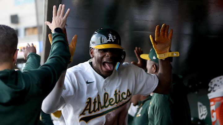 Apr 14, 2026; West Sacramento, California, USA; Athletics center fielder Denzel Clark (1) reacts in the dugout after scoring a run against the Texas Rangers during the third inning at Sutter Health Park. Mandatory Credit: Dennis Lee-Imagn Images