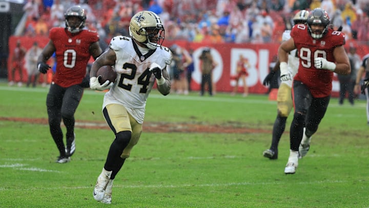 Dec 7, 2025; Tampa, Florida, USA; New Orleans Saints running back Devin Neal (24) runs for a gain during the third quarter against the Tampa Bay Buccaneers at Raymond James Stadium. Mandatory Credit: Kim Klement Neitzel-Imagn Images