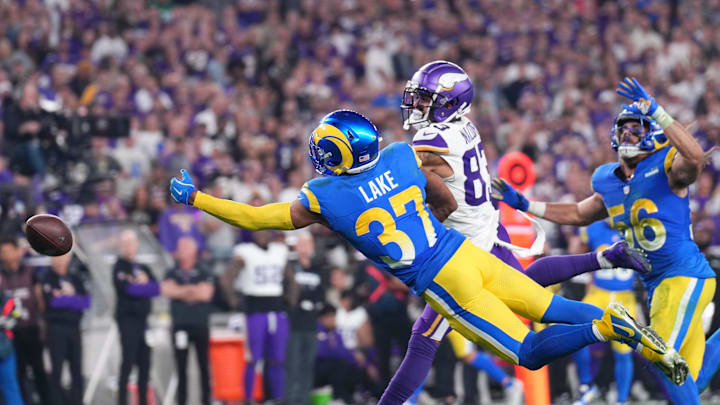 Jan 13, 2025; Glendale, AZ, USA; Los Angeles Rams safety Quentin Lake (37) dives attempting to make an interception against the Minnesota Vikings during the second half in an NFC wild card game at State Farm Stadium. Mandatory Credit: Joe Camporeale-Imagn Images