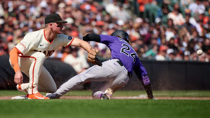 Colorado Rockies third baseman Ryan McMahon (24) slides into third base with an RBI triple against the San Francisco Giants during the eighth inning at Oracle Park on May 4.