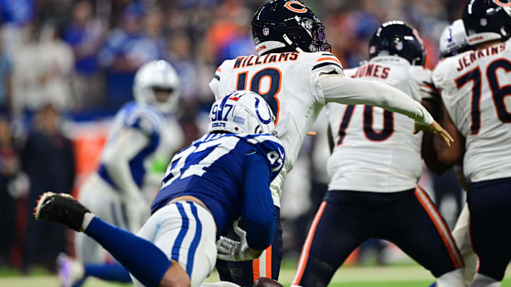Sep 22, 2024; Indianapolis, Indiana, USA; Indianapolis Colts defensive end Laiatu Latu (97) knocks the ball away from Chicago Bears quarterback Caleb Williams (18) during the second half at Lucas Oil Stadium. Mandatory Credit: Marc Lebryk-Imagn Images
Sep 22, 2024; Indianapolis, Indiana, USA; Indianapolis Colts defensive end Laiatu Latu (97) knocks the ball away from Chicago Bears quarterback Caleb Williams (18) during the second half at Lucas Oil Stadium. Mandatory Credit: Marc Lebryk-Imagn Images