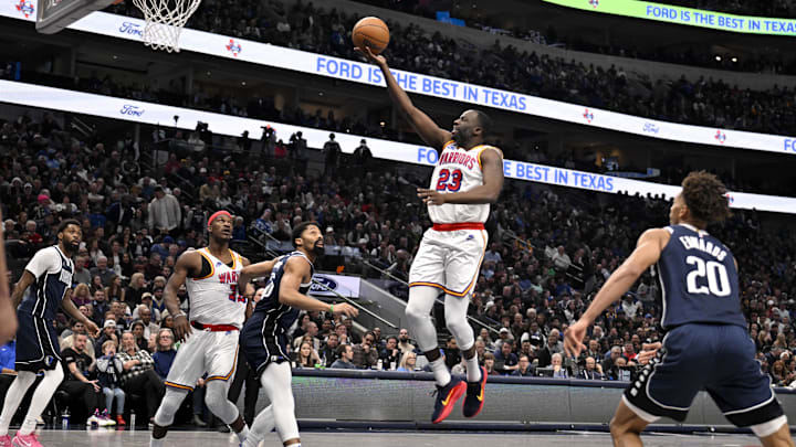 Golden State Warriors forward Green shoots the ball over Dallas Mavericks guard Dinwiddie and forward Edwards during the second quarter at the American Airlines Center. 
