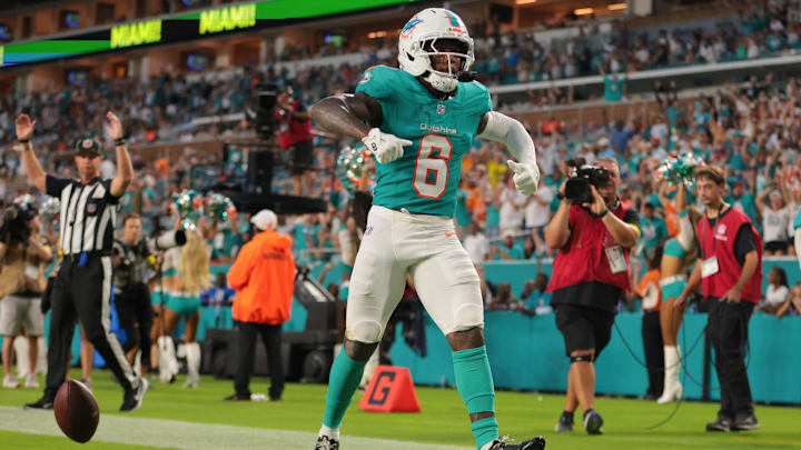 Aug 23, 2025; Miami Gardens, Florida, USA; Miami Dolphins wide receiver Malik Washington (6) celebrates after scoring a touchdown against the Jacksonville Jaguars during the second quarter at Hard Rock Stadium. Mandatory Credit: Sam Navarro-Imagn Images