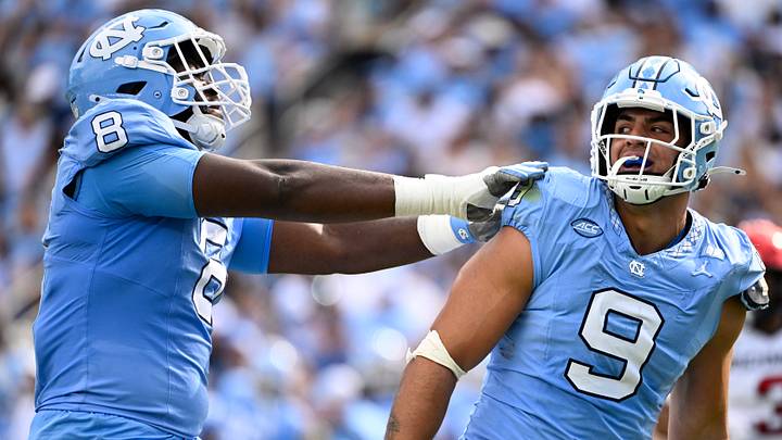 Sep 13, 2025; Chapel Hill, North Carolina, USA; North Carolina Tar Heels defensive lineman Melkart Abou-Jaoude (9 ) celebrates with defensive lineman Smith Vilbert (8) after making a sack in the first quarter at Kenan Stadium. Mandatory Credit: Bob Donnan-Imagn Images Sep 13, 2025; Chapel Hill, North Carolina, USA; North Carolina Tar Heels defensive lineman Melkart Abou-Jaoude (9 ) celebrates with defensive lineman Smith Vilbert (8) after making a sack in the first quarter at Kenan Stadium. Mandatory Credit: Bob Donnan-Imagn Images