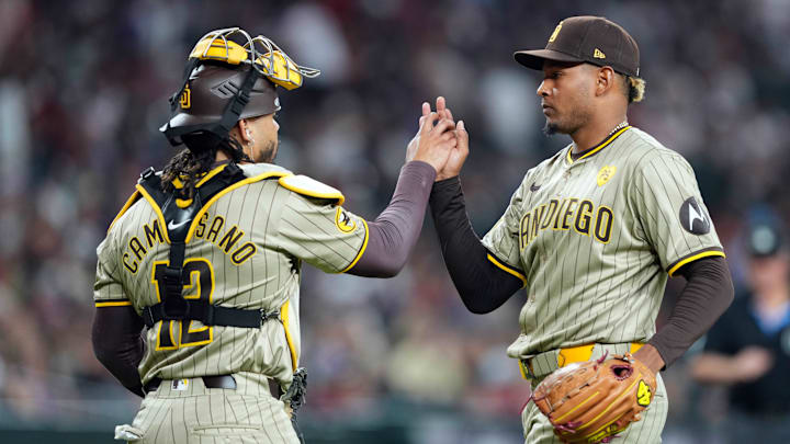 May 3, 2024; Phoenix, Arizona, USA; San Diego Padres catcher Luis Campusano (12) and San Diego Padres pitcher Jhony Brito (76) shakes hands after the ninth inning against the Arizona Diamondbacks at Chase Field. Mandatory Credit: Joe Camporeale-Imagn Images