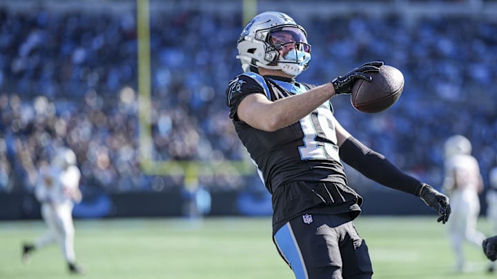 Dec 22, 2024; Charlotte, North Carolina, USA;  Carolina Panthers wide receiver Adam Thielen (19) reacts to his touchdown catch against the Arizona Cardinals during the second quarter at Bank of America Stadium.