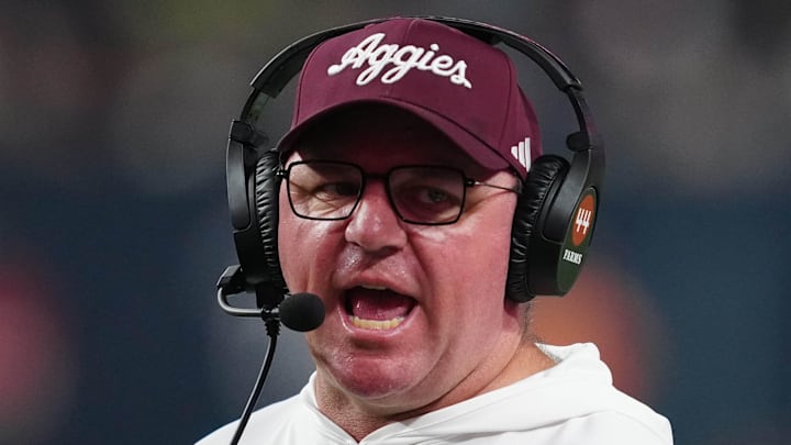 Dec 27, 2024; Las Vegas, NV, USA; Texas A&M Aggies head coach Mike Elko reacts against the Southern California Trojans in the second half at Allegiant Stadium. Mandatory Credit: Kirby Lee-Imagn Images Dec 27, 2024; Las Vegas, NV, USA; Texas A&M Aggies head coach Mike Elko reacts against the Southern California Trojans in the second half at Allegiant Stadium. Mandatory Credit: Kirby Lee-Imagn Images