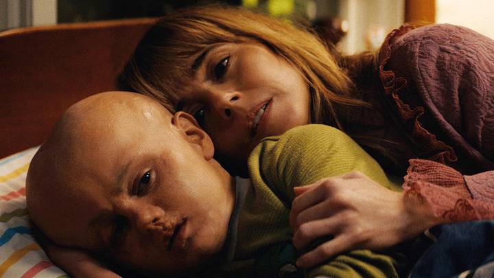 Callum Vinson as Jason Voorhees, Linda Cardellini as Pam Voorhees in Crystal Lake Callum Vinson as Jason Voorhees, Linda Cardellini as Pam Voorhees in Crystal Lake