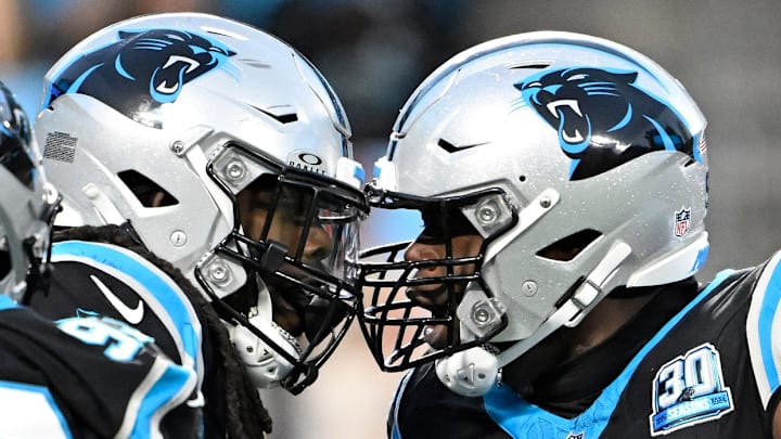 Dec 1, 2024; Charlotte, North Carolina, USA; Carolina Panthers linebacker Jadeveon Clowney (7) celebrates with defensive end A'Shawn Robinson (94) after sacking Tampa Bay Buccaneers quarterback Baker Mayfield (6) in the second quarter at Bank of America Stadium. Dec 1, 2024; Charlotte, North Carolina, USA; Carolina Panthers linebacker Jadeveon Clowney (7) celebrates with defensive end A'Shawn Robinson (94) after sacking Tampa Bay Buccaneers quarterback Baker Mayfield (6) in the second quarter at Bank of America Stadium.