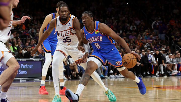 Nov 12, 2023; Phoenix, Arizona, USA; Oklahoma City Thunder forward Jalen Williams (8) drives to the net against Phoenix Suns forward Kevin Durant (35) during the second half at Footprint Center. Mandatory Credit: Zachary BonDurant-Imagn Images