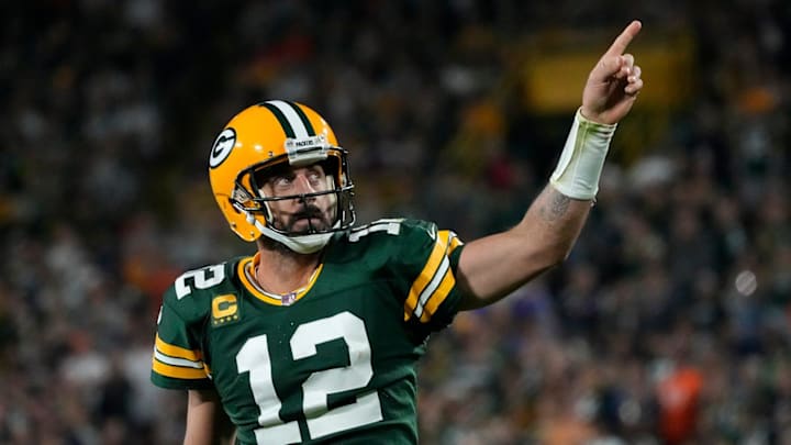 Green Bay Packers quarterback Aaron Rodgers (12) celebrates after rushing for a first down against the Bears in 2022. Green Bay Packers quarterback Aaron Rodgers (12) celebrates after rushing for a first down against the Bears in 2022.