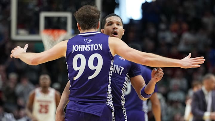 High Point players celebrate after a made basket vs. Wisconsin.