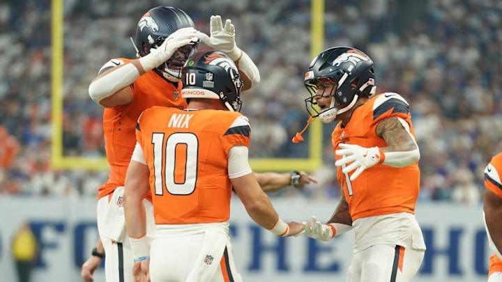 Sep 14, 2025; Indianapolis, Indiana, USA; Denver Broncos quarterback Bo Nix (10) celebrates a touchdown scored by wide receiver Marvin Mims Jr. (19) (not pictured) during the first quarter against the Carolina Panthers at Lucas Oil Stadium. Sep 14, 2025; Indianapolis, Indiana, USA; Denver Broncos quarterback Bo Nix (10) celebrates a touchdown scored by wide receiver Marvin Mims Jr. (19) (not pictured) during the first quarter against the Carolina Panthers at Lucas Oil Stadium.