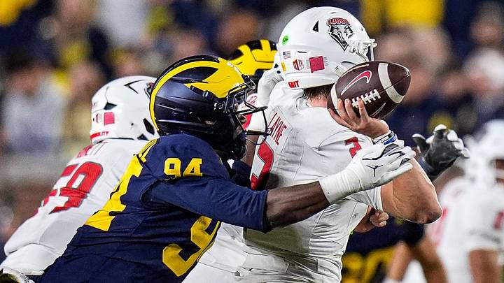 Michigan edge Nate Marshall (94) tackles New Mexico quarterback Jack Layne (2) during the second half at Michigan Stadium in Ann Arbor on Saturday, August 30, 2025.