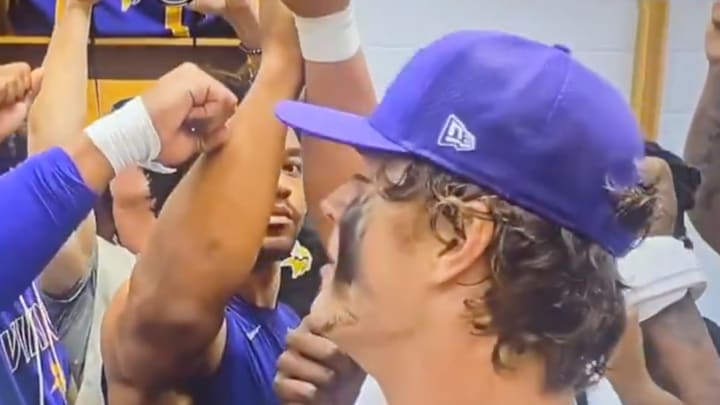 J.J. McCarthy celebrates with teammates after comeback victory.