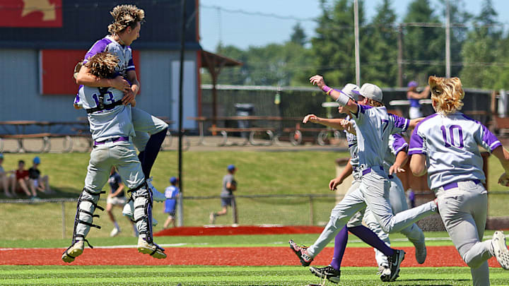 Sunset catcher Kyle Gresham (13) hugs pitcher Kruz Schoolcraft as other Apollos, including Parker Raubuch (10), Luke Sullivan (7) and Marcus Pollard (4) rush in following the final out in Sunset’s 6-5 win over Grant in the Class 6A state championship game.
